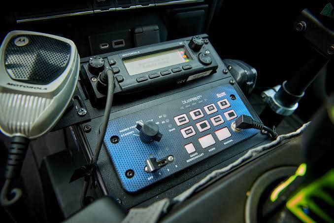 Motorola mobile radio and SoundOff bluePRINT siren and lighting controller mounted in an emergency vehicle console