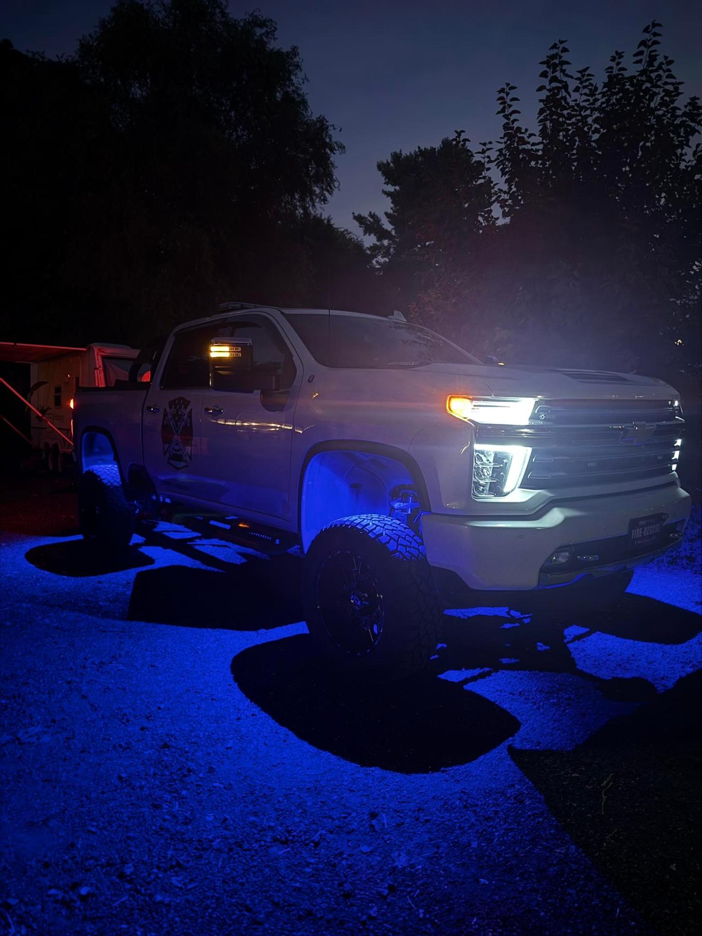 Modern pickup truck with professional projector headlight retrofit and subtle accent lighting